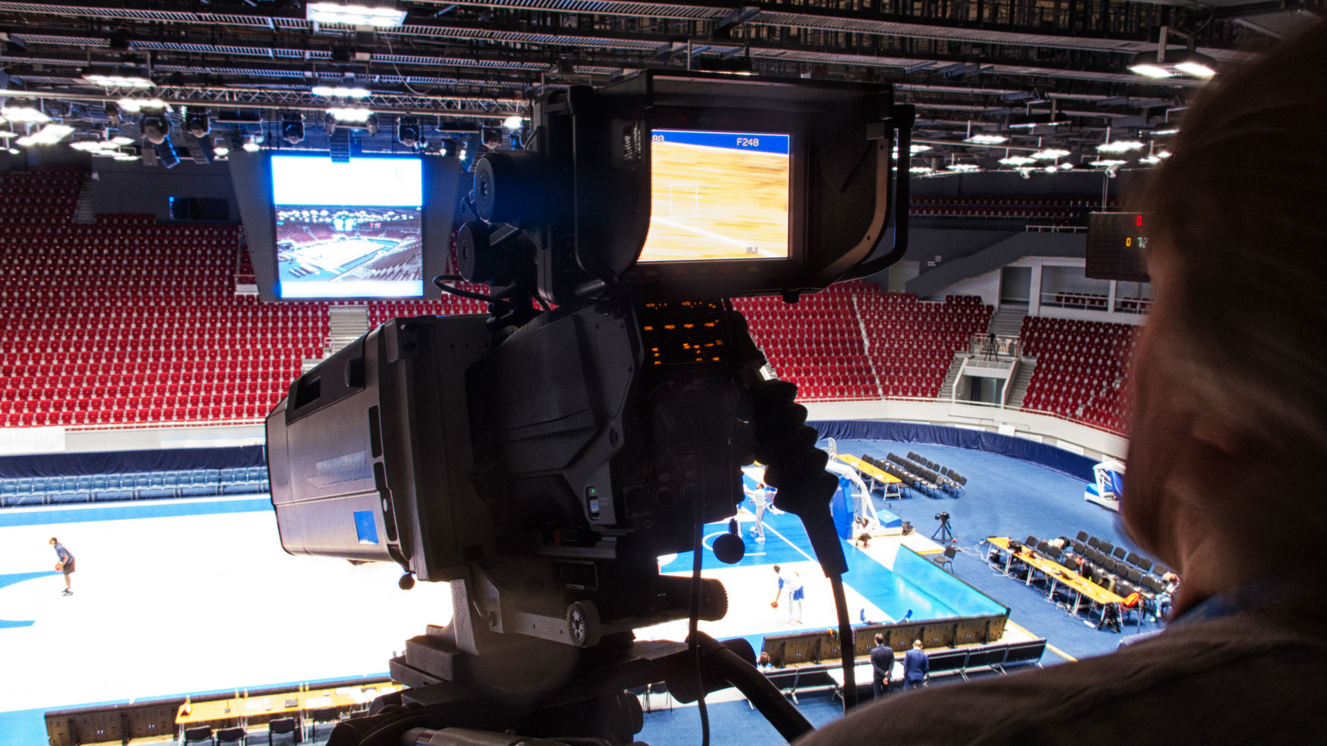 Camera man filming a sporting event
